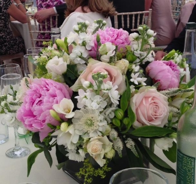 Cube vase in seasonal flowers