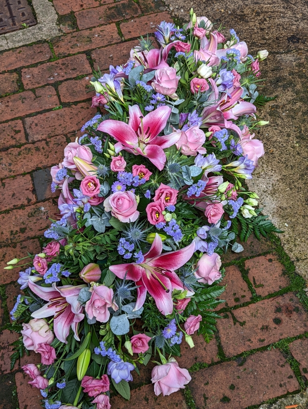 Pastels casket spray