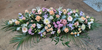 Pastels casket spray