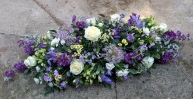 Blue and white casket spray