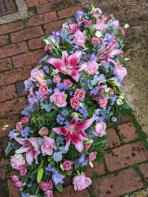 Pastels casket spray